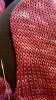 Knitted fabric with left edge curled under